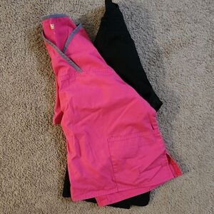2 womens wink scrub tops. Both medium  v neck. 1-black 1- pink w/ grey  trim